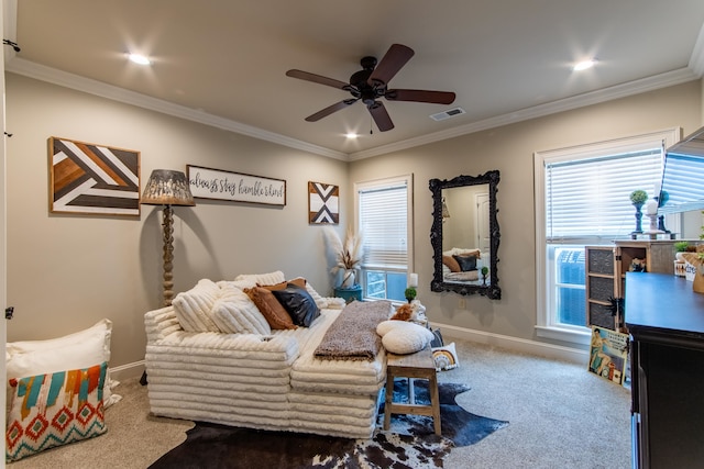 bedroom featuring ornamental molding, carpet, and ceiling fan