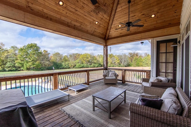 deck featuring ceiling fan and an outdoor hangout area