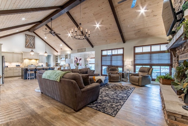 living room featuring beamed ceiling, high vaulted ceiling, and light wood-type flooring