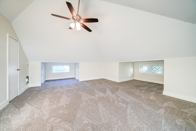 bonus room featuring ceiling fan, vaulted ceiling, plenty of natural light, and carpet floors