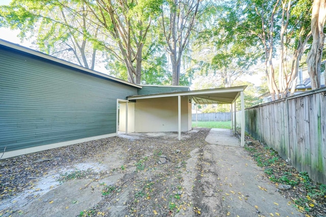 exterior space with a patio area and a carport