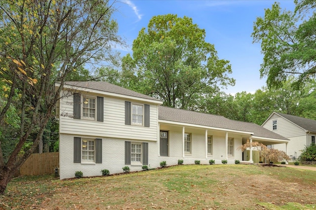 tri-level home featuring a front lawn