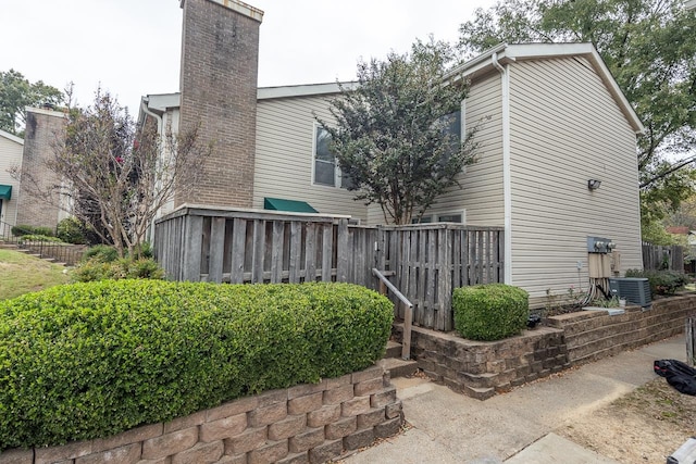 view of side of property with central AC