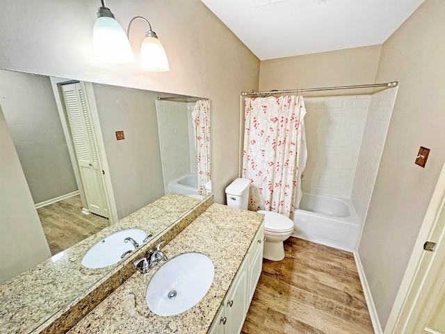 full bathroom featuring hardwood / wood-style floors, vanity, toilet, and shower / bathtub combination with curtain