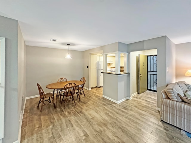 dining room featuring light hardwood / wood-style floors