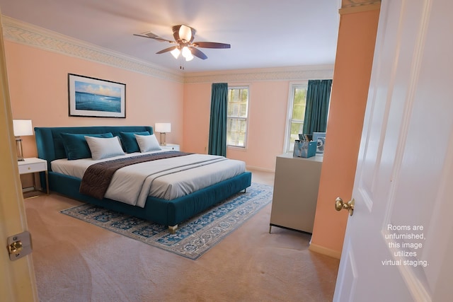 bedroom with ceiling fan, ornamental molding, and light colored carpet