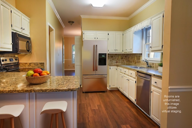 kitchen with white cabinetry and stainless steel appliances