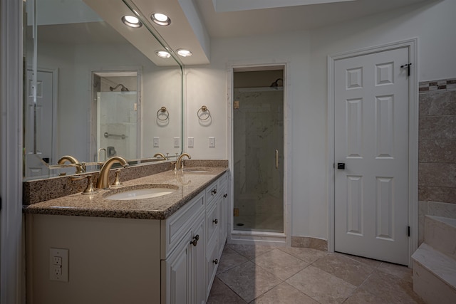 bathroom with vanity, tile patterned floors, and walk in shower