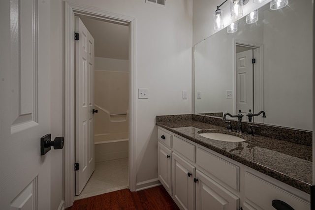 bathroom with vanity and hardwood / wood-style flooring