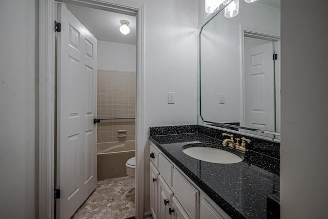 bathroom featuring vanity, toilet, and tile patterned floors