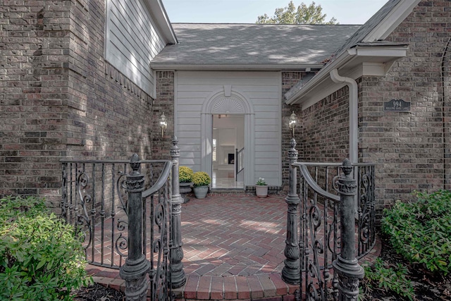 view of exterior entry featuring a patio