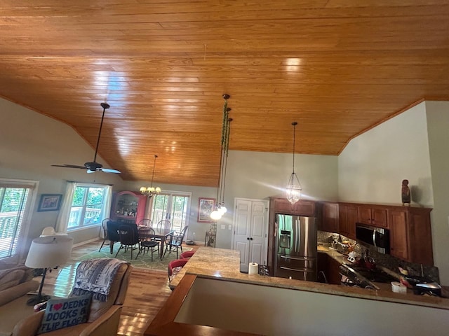 kitchen with appliances with stainless steel finishes, wooden ceiling, ceiling fan with notable chandelier, and pendant lighting