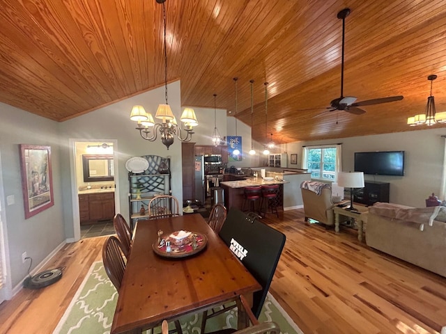 dining space with wooden ceiling, vaulted ceiling, and light wood-type flooring