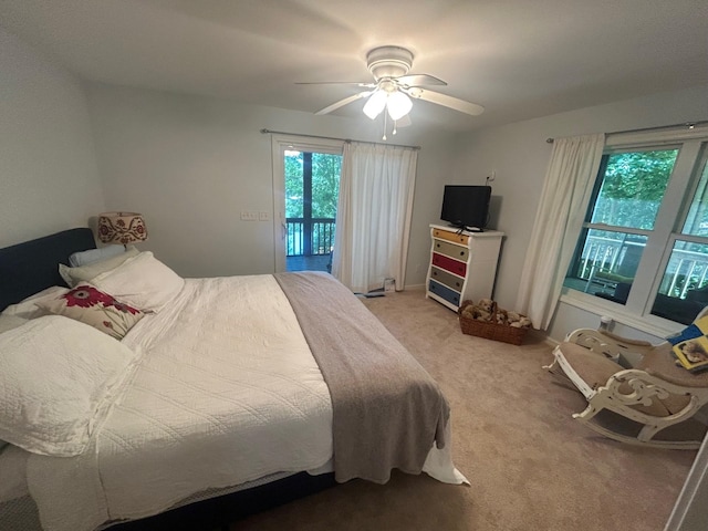 bedroom with carpet floors, access to exterior, and ceiling fan