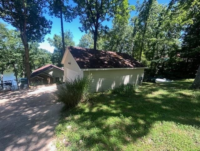 view of property exterior featuring a lawn