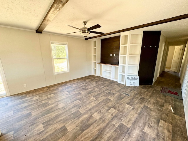 unfurnished living room featuring beamed ceiling, dark hardwood / wood-style floors, a textured ceiling, and ceiling fan