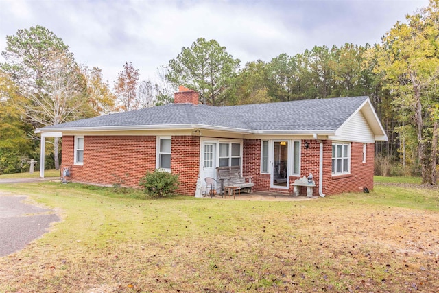 ranch-style home with a front yard