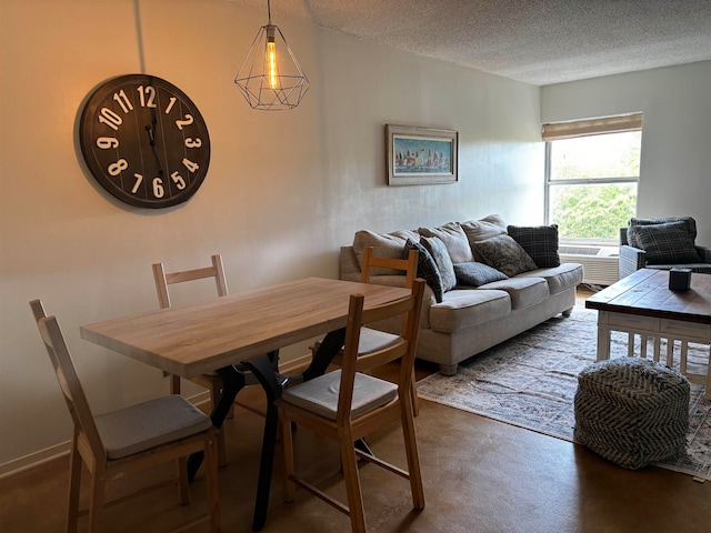 dining room with a textured ceiling