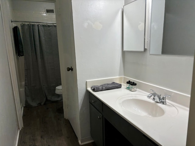 full bathroom with vanity, shower / bath combination with curtain, toilet, and wood-type flooring