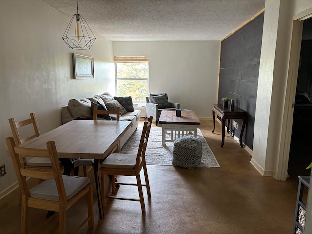 dining room with a textured ceiling