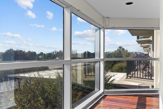 unfurnished sunroom with plenty of natural light