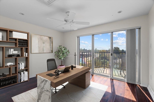 office area featuring ceiling fan and dark hardwood / wood-style floors