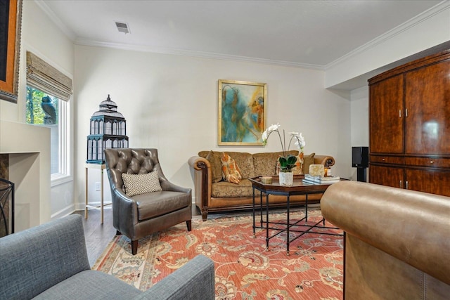 living room featuring crown molding and light wood-type flooring