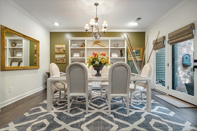 dining space featuring an inviting chandelier, ornamental molding, and dark hardwood / wood-style flooring