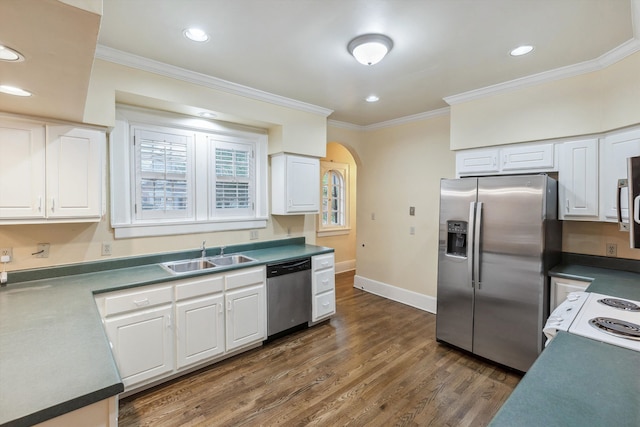 kitchen featuring dark hardwood / wood-style floors, stainless steel appliances, crown molding, sink, and white cabinetry