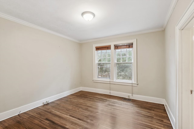 spare room with crown molding and dark hardwood / wood-style flooring