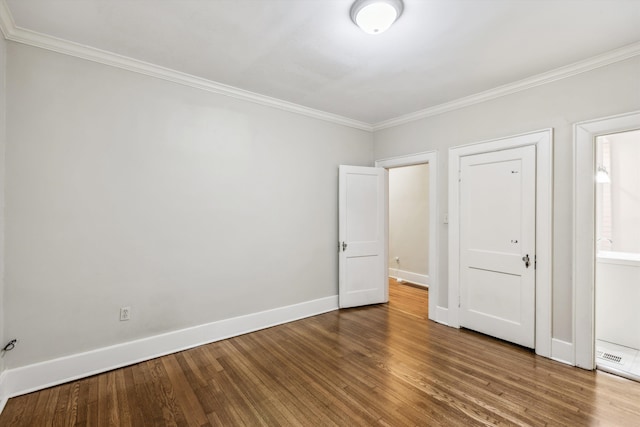 unfurnished bedroom featuring ornamental molding and wood-type flooring