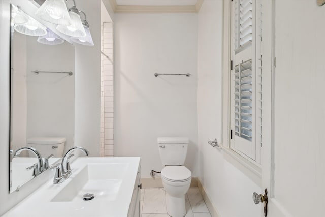 bathroom featuring vanity, ornamental molding, and toilet