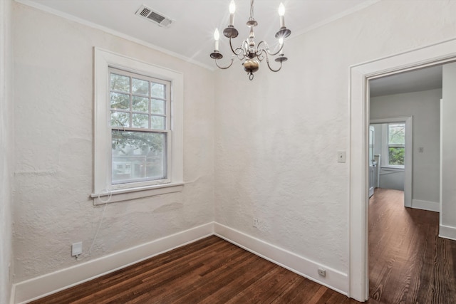 unfurnished dining area with ornamental molding, dark wood-type flooring, and plenty of natural light