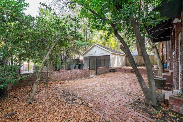 view of yard with a patio and an outbuilding