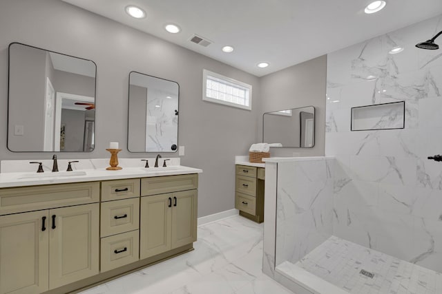 bathroom featuring a sink, marble finish floor, a marble finish shower, visible vents, and double vanity