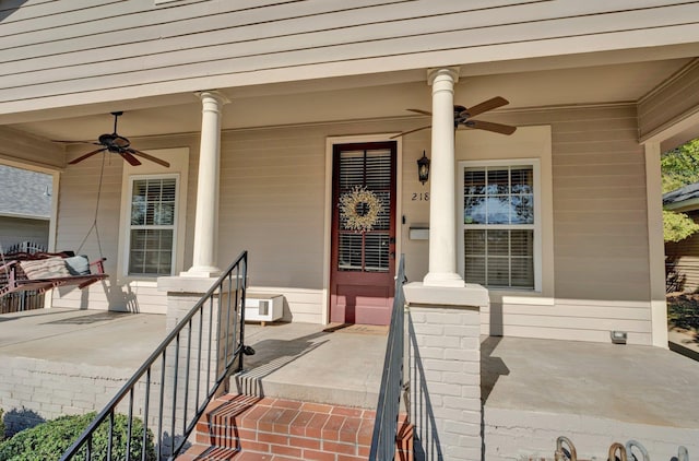 doorway to property featuring ceiling fan and covered porch