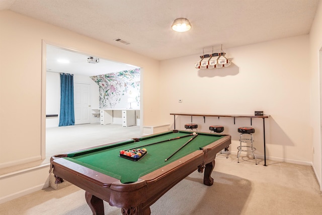 recreation room with vaulted ceiling, a textured ceiling, carpet floors, and pool table