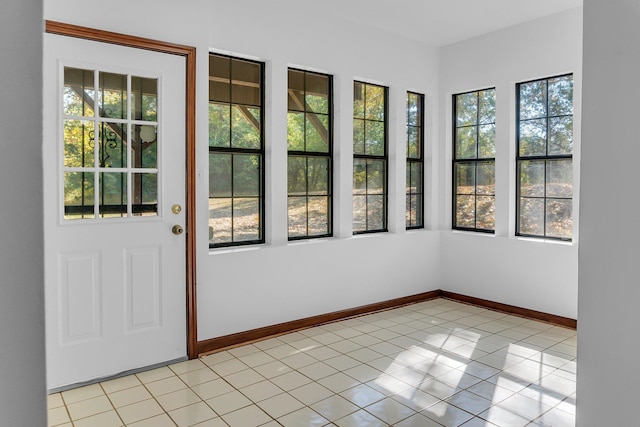 unfurnished sunroom featuring plenty of natural light