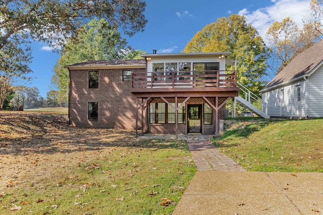 rear view of property featuring french doors, a deck, and a lawn