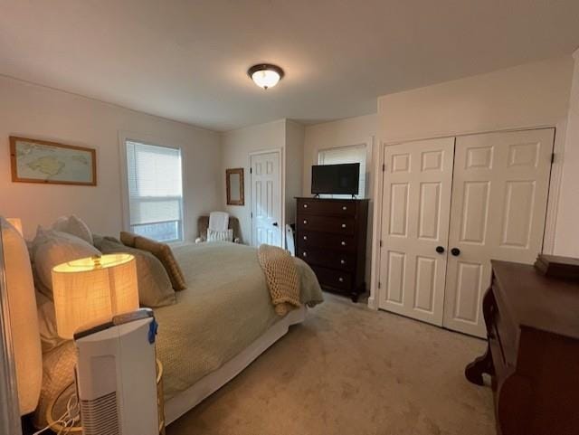 bedroom featuring light colored carpet