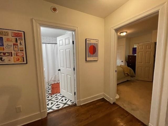 hallway featuring dark wood-type flooring