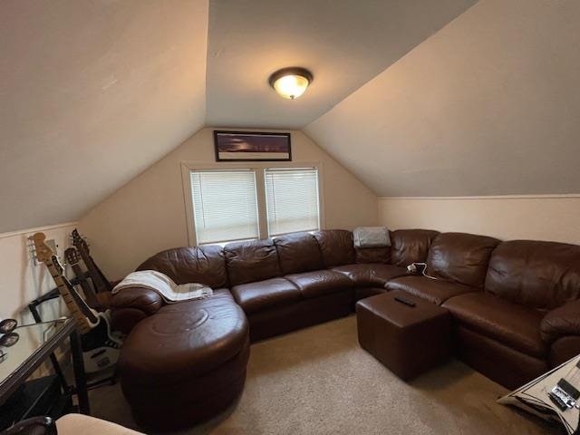 living room with carpet flooring and vaulted ceiling