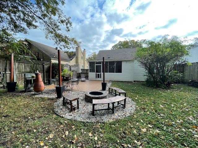 view of yard with a patio area and a fire pit