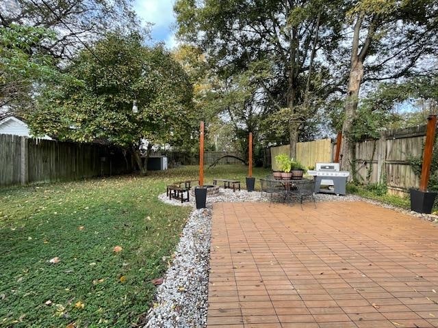 view of yard with a patio area and a fire pit