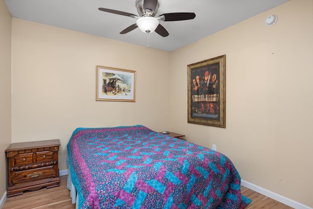 bedroom featuring light hardwood / wood-style flooring and ceiling fan