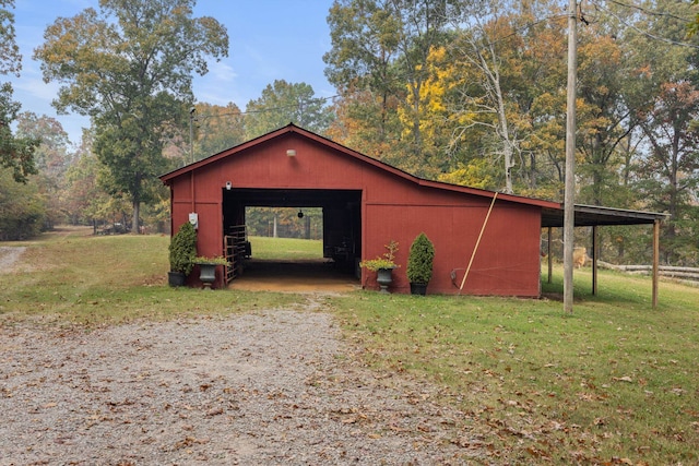 view of outbuilding with a yard