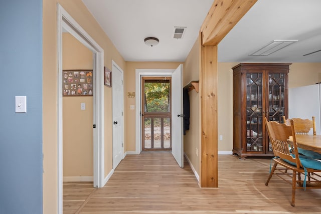 doorway to outside featuring light hardwood / wood-style flooring