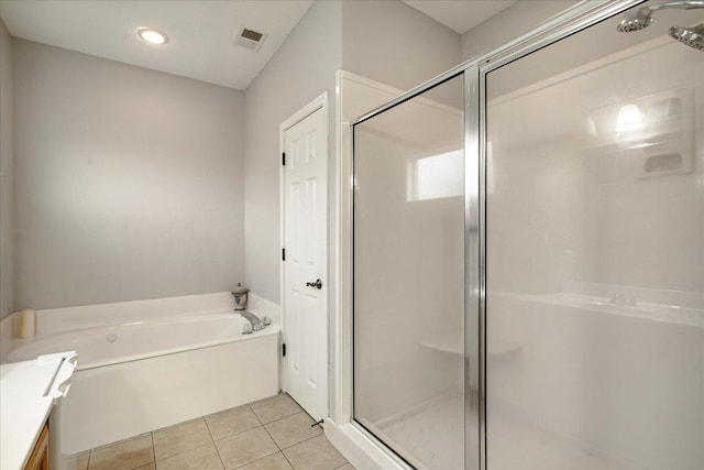 bathroom with vanity, plus walk in shower, and tile patterned flooring