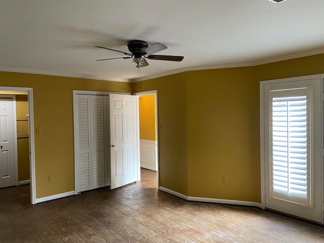 unfurnished bedroom with crown molding, wood-type flooring, and ceiling fan