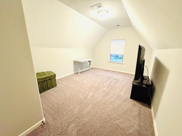 bonus room featuring lofted ceiling and carpet floors